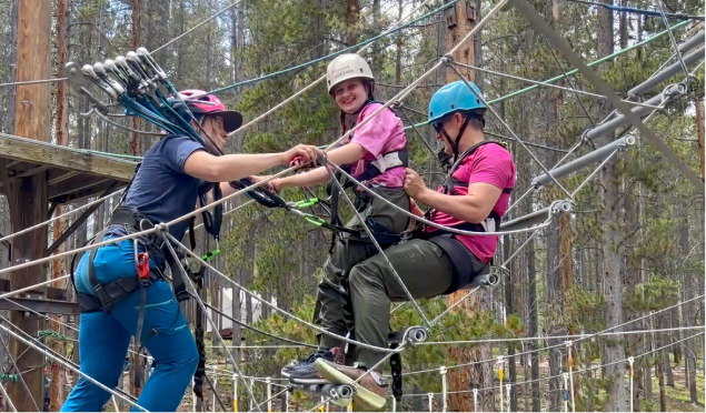 Ruby and her dad skiing