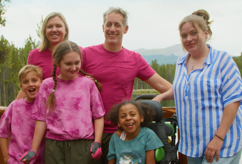 Two families gathered together before a ropes course adventure