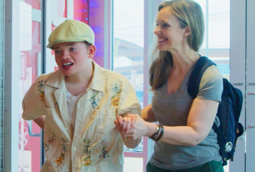 Family arriving at an indoor skydiving facility before their adaptive adventure